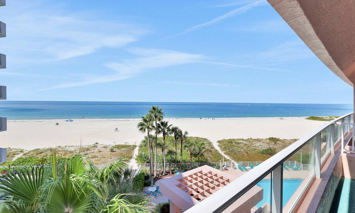 Sand Key Condo | Beachfront condo with multiple balconies heated pool gym hot tub and AC