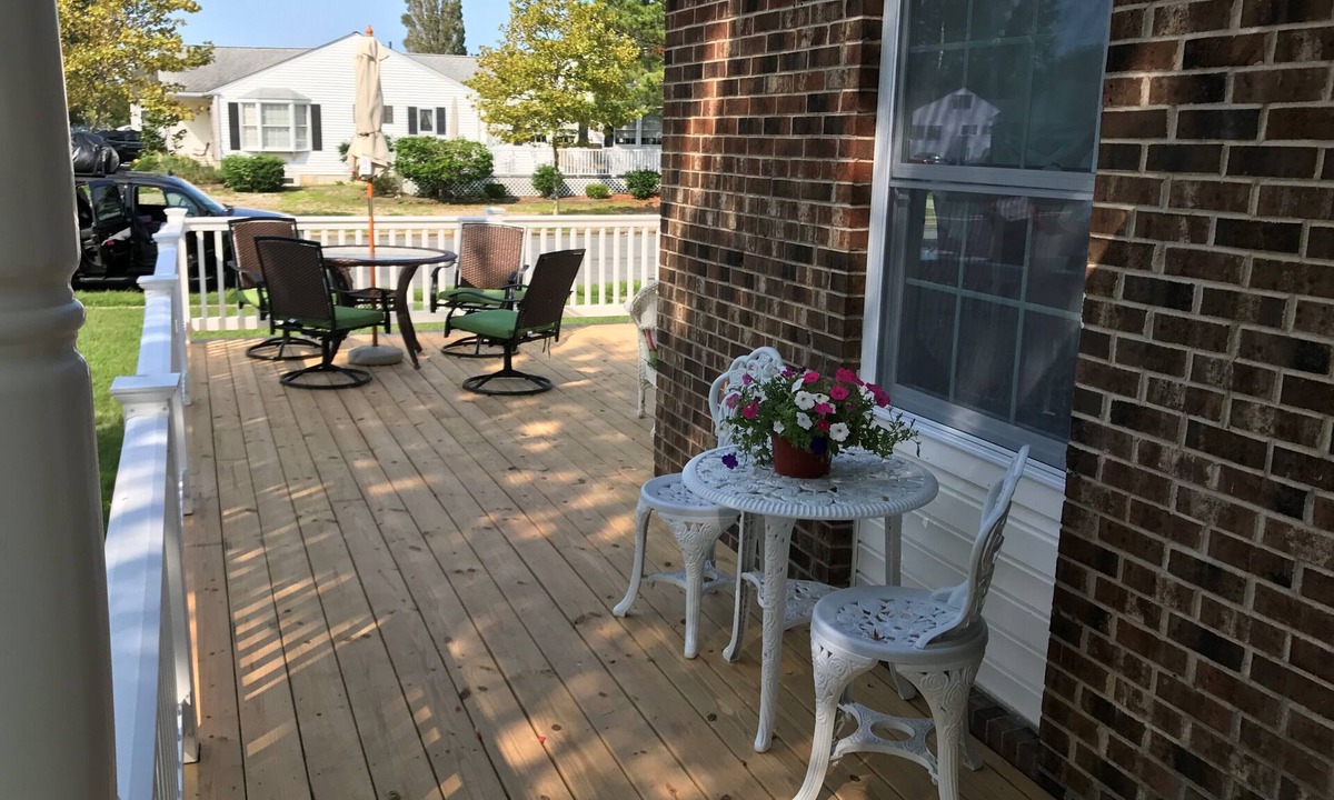 Village Green House | Beautiful corner property with cozy beach vibe.