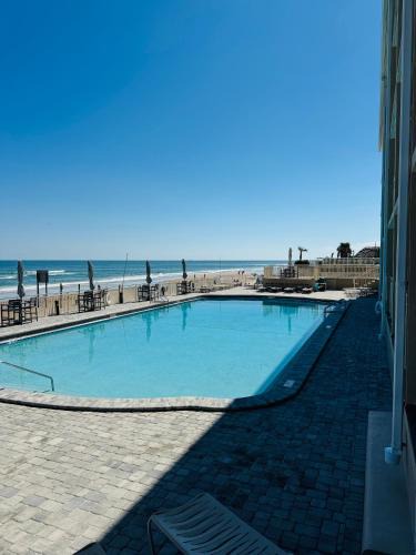 Daytona Beach Apartment | Daytona Inn Beach Resort Step Outside and Put Your Feet in the Sand Beach Vibes