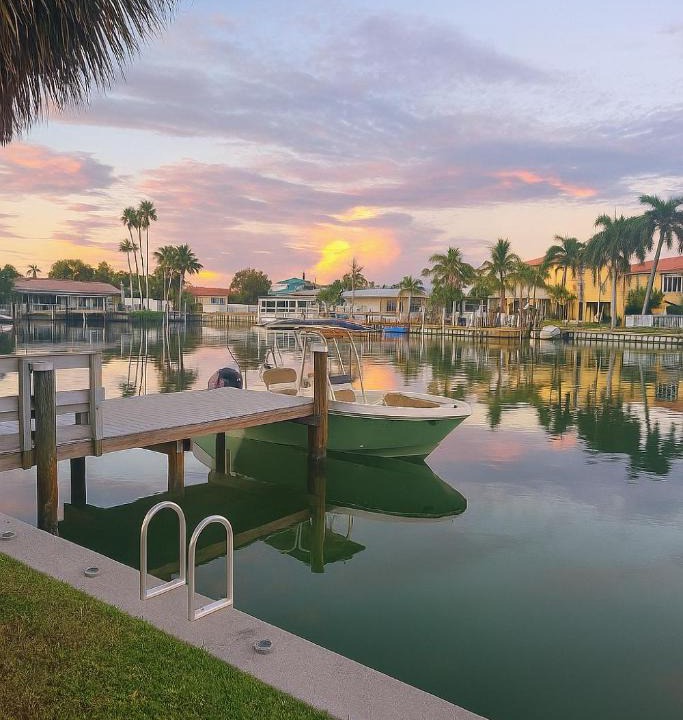 Capri Isle Apartment | Oasis Waterfront Treasure Island Condo with Patio Dock and Johns Pass