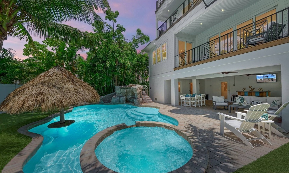Holmes Beach House | Perfect Vacation Home with Pool, Putting Green, and Waterslide