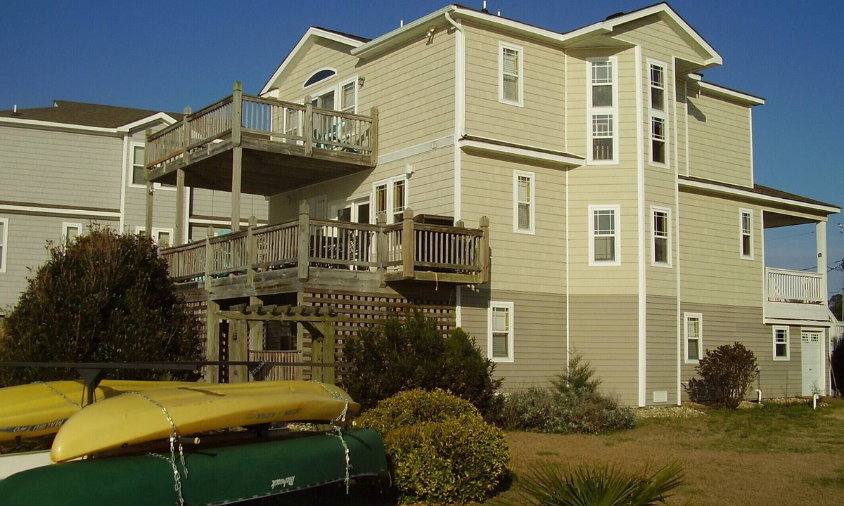 Colington Harbour House | Sunset Memories on the water. Large Private Dock, Kayaks, Paddleboards & Canoe.