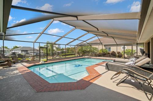 Apollo Beach House | Surfside Beach House - Gorgeous Canal Front Home - Heated Pool & Boat Dock