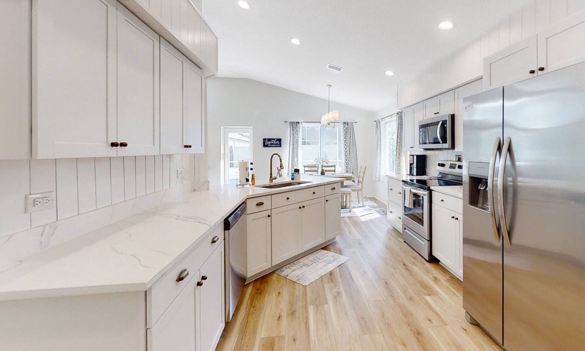 Indian Trails House | The Barefoot Bungalow House in Palm Coast With an Enclosed Pool & Grill