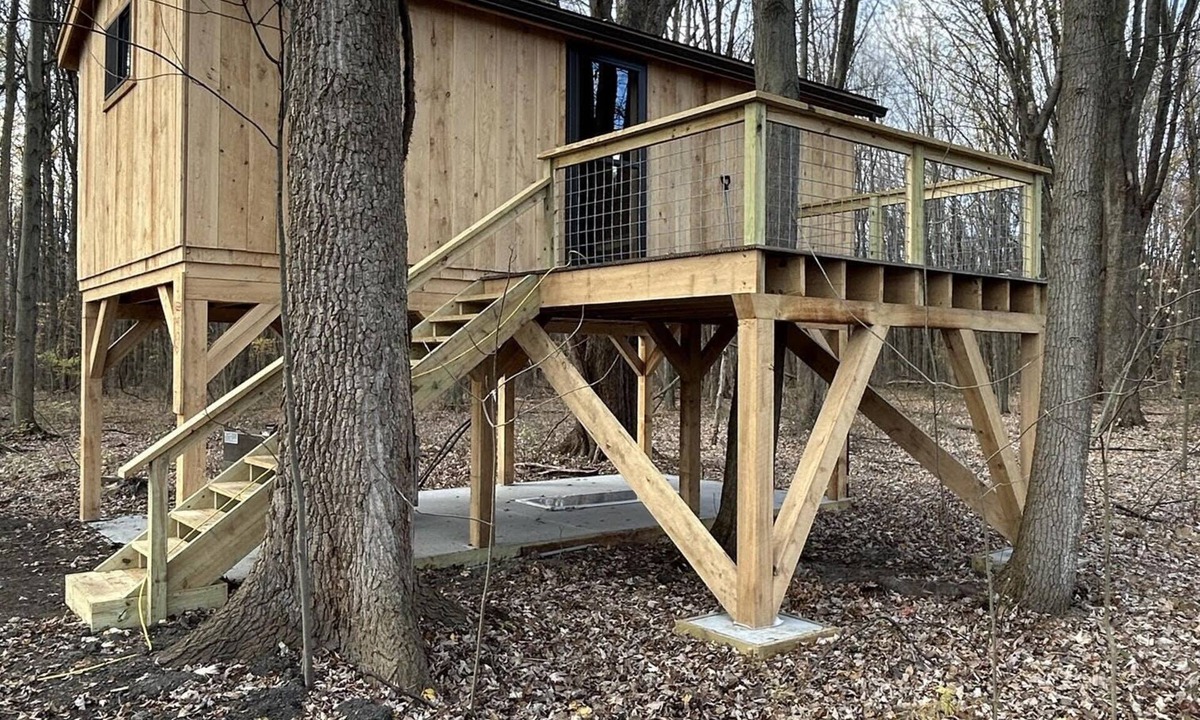 Girard Cabin | Timber framed tree cabin nestled in the woods.