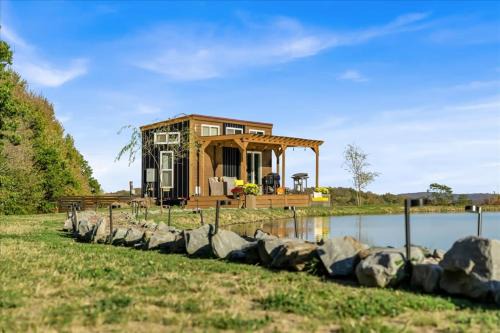 Brackney House | Tiny House On a Tiny Lake Porch at Waters Edge