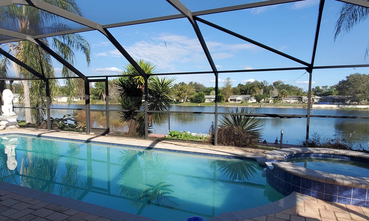 Jasmine Lakes House | Tropical Waterfront HEATED Pool/SPA Home by 9 BEACHES & 9 STATE PARKS SLEEPS 11