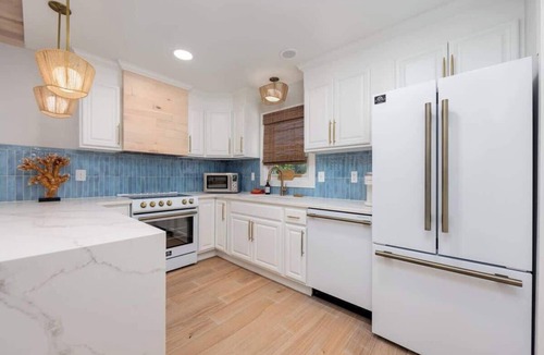 Colington House | 2 Private Living Spaces, 2 Hot Tubs and Bikes!