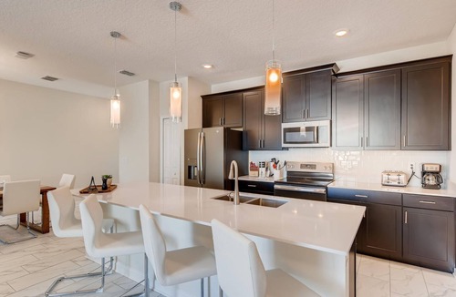 Four Corners Villa | 8953 CC - 4BR Townhome with Sparkling Pool