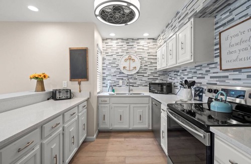 Siesta Key Condo | Bayfront Balconies in Tropical Siesta Key with Sunrise Views & Walkable Beach Access