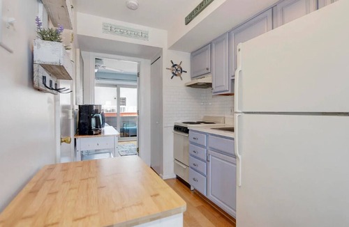 Southend Condo | Beach Block! Beautifully furnished 1 bed/1 bath steps to the sand