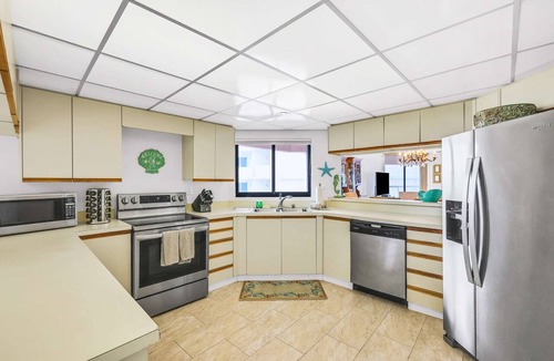 Sand Key Condo | Beachfront condo with multiple balconies heated pool gym hot tub and AC