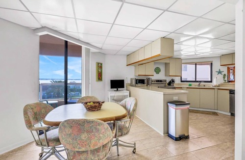 Sand Key Condo | Beachfront condo with multiple balconies heated pool gym hot tub and AC