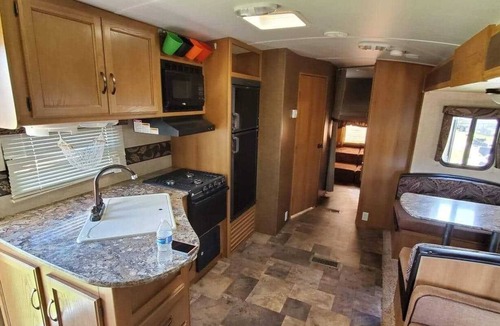 Dade City House | Beautiful travel trailer with private fenced in yard, deck, and fire pit.