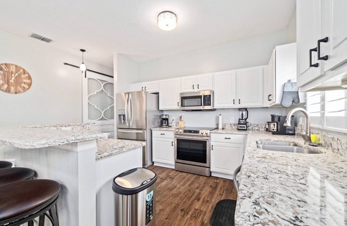 Palm Harbor House | Best-Priced Palm Harbor Retreat | Heated Saltwater Pool, Games & Beach Gear Included