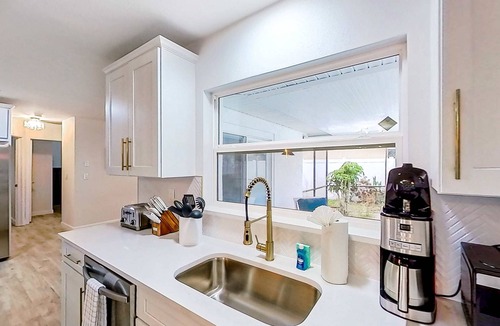 Dunedin House | Bright and open home with private pool screened lanai enclosed yard and WD