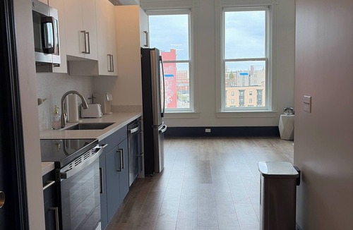 Central Business District Apartment | Bright Sunlit Studio in Downtown Rochester Floor-to-Ceiling Windows