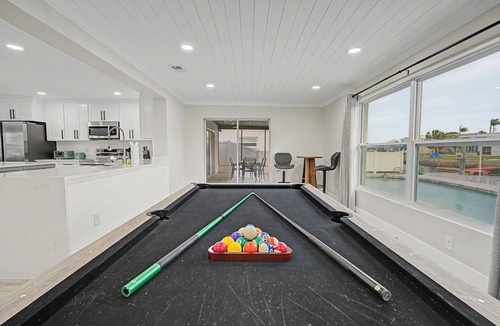 Port Richey House | Canal Front Getaway | Pool, Dock, Game Room + Screened Porch