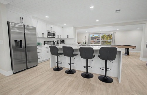 Port Richey House | Canal Front Getaway | Pool, Dock, Game Room + Screened Porch