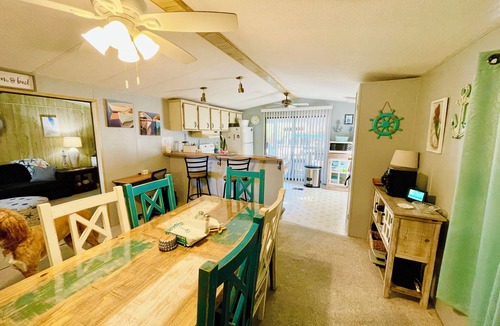 Weeki Wachee Gardens House | Charming 2/2 waterfront farm home with tons of TV stations, WiFi, dock, & more