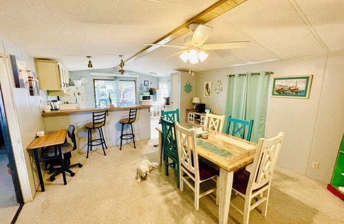 Weeki Wachee Gardens House | Charming 2/2 waterfront farm home with tons of TV stations, WiFi, dock, & more