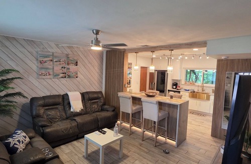 Lake Magdalene House | Cozy tropical home with lush palms, warm lights & relaxing vibe.