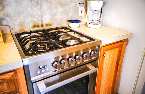 Eddyville Cabin | Deckside Haven 2 - Tiny living space with a queen and full size beds overlooking Lake Barkley.