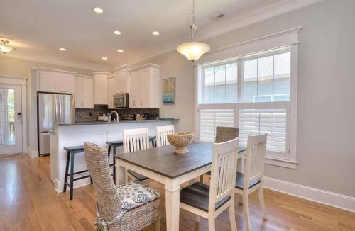 Tranquil Harbour House | Discover Almost Heaven in Oak Island: a cozy 3-bedroom retreat with pool access.