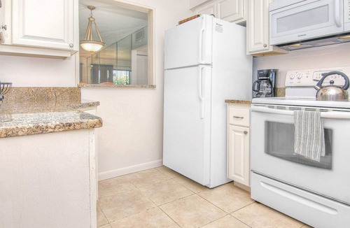 Belleair Beach Condo | Elegant 1st floor condo w private patio AC on site outdoor pool and gas grills