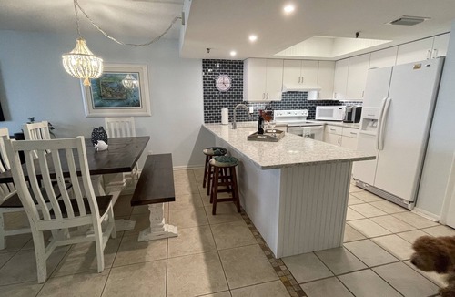 Indian Shores Condo | Enjoy beautiful sunsets from the balcony or wade into the waves just steps away!