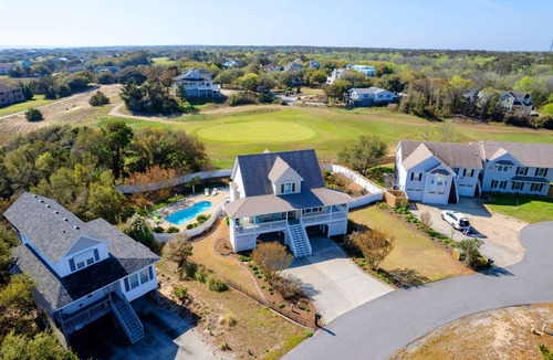 Sea Scape House | Entire home in Kitty Hawk, NC. Pool, hot tub, & spacious backyard!