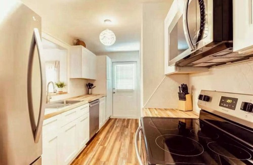 Bayou Oaks House | Exquisite bungalow with shared pool, washer & dryer, and WIFI