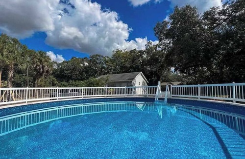 Bayou Oaks House | Exquisite bungalow with shared pool, washer & dryer, and WIFI