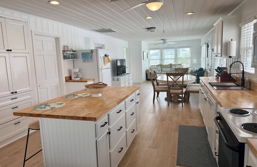 North Myrtle Beach Cottage | Fabulous 4-bedroom channel home with private dock in Cherry Grove Beach.