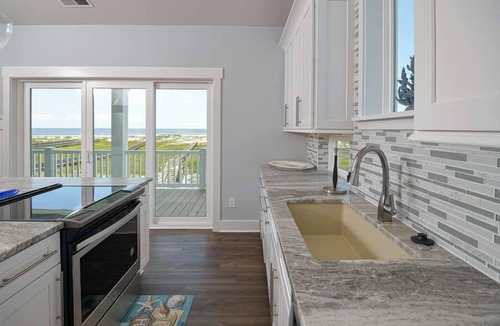 Holden Beach House | Hobbs Realty - "Coast is Clear," an oceanfront home with a heatable pool, hot tub, and elevator.