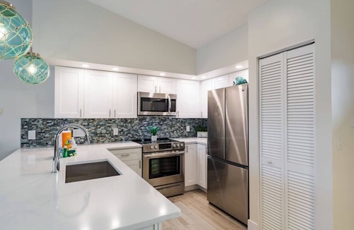 Holmes Beach House | Home with heated pool, spa, games, walk to beach