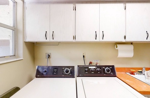 East Lake House | Inviting home with pool, patio, grill, full kitchen, central AC, & W/D