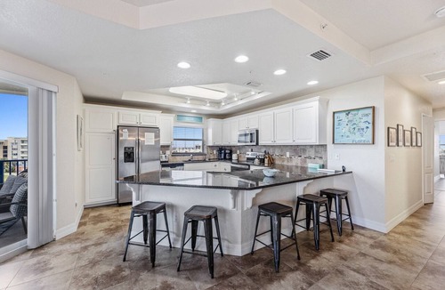 New Smyrna Beach Condo | Large Corner Unit at Ocean Walk with Sneak Peak of the Ocean ~ OW20-501