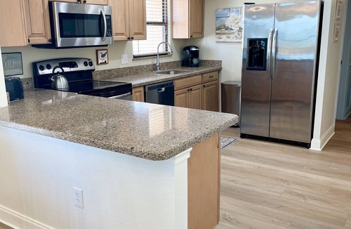Madeira Beach Condo | Luxury Beachfront Corner Condo 3 BR 2 BA with a Pool - It’s 5 o’clock somewhere!