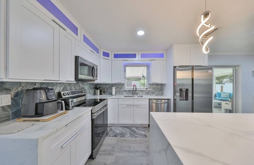 Palma Sola House | Modern Family Beach Oasis w/Heated Saltwater Pool Home, 5 miles from Anna Maria