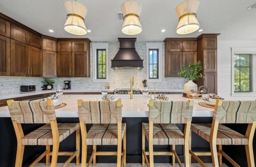 Saint Armands Key House | New 8 bedroom house with tropical oasis backyard! Heated pool and spa.