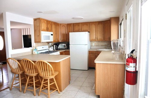 Mystic Island House | New! Spacious 4-Bedroom, Sleeps & Seats 12, Waterfront in Little Egg Harbor