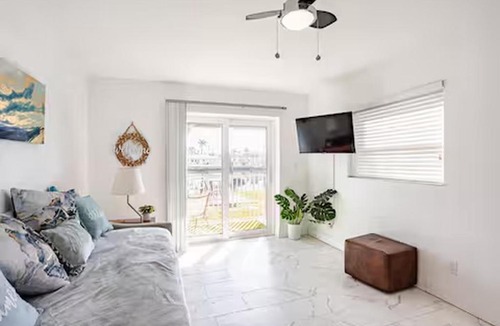 Capri Isle Apartment | Oasis Waterfront Treasure Island Condo with Patio Dock and Johns Pass