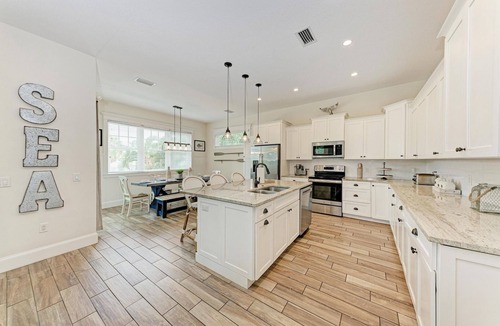 Holmes Beach House | Perfect Vacation Home with Pool, Putting Green, and Waterslide