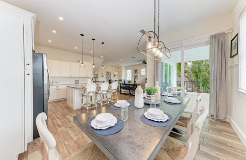 Holmes Beach House | Perfect Vacation Home with Pool, Putting Green, and Waterslide