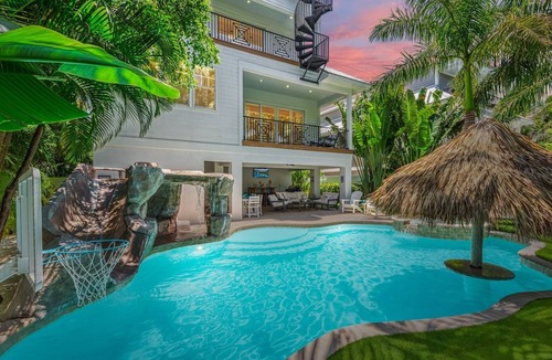 Holmes Beach House | Perfect Vacation Home with Pool, Putting Green, and Waterslide