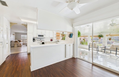 Surfside Estates House | Pet-friendly 3BR beachside home with fenced yard, hot tub, Green Egg grill, and beach gear! Walk to the ocean and relax in your private coastal backyard oasis.