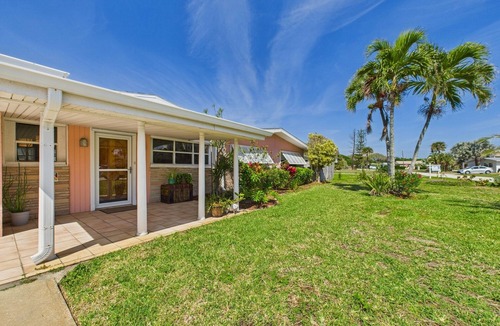 Surfside Estates House | Pet-friendly 3BR beachside home with fenced yard, hot tub, Green Egg grill, and beach gear! Walk to the ocean and relax in your private coastal backyard oasis.