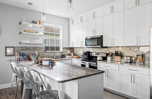 Ybor City House | Pet-Friendly Home with Hot Tub, Climbing Wall, and Gym by Mane Suites!