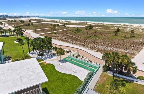 Treasure Island Condo | 🌴Poolside Studio @ Tropic Terrace | Ground Floor Steps to Beach King Bed ➠ TT10